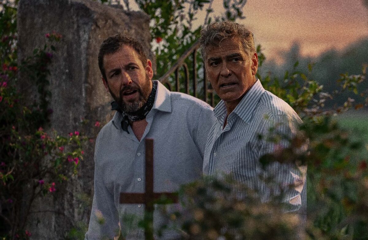 Adam Sandler as Ron Sukenick and George Clooney as Jay Kelly in Jay Kelly