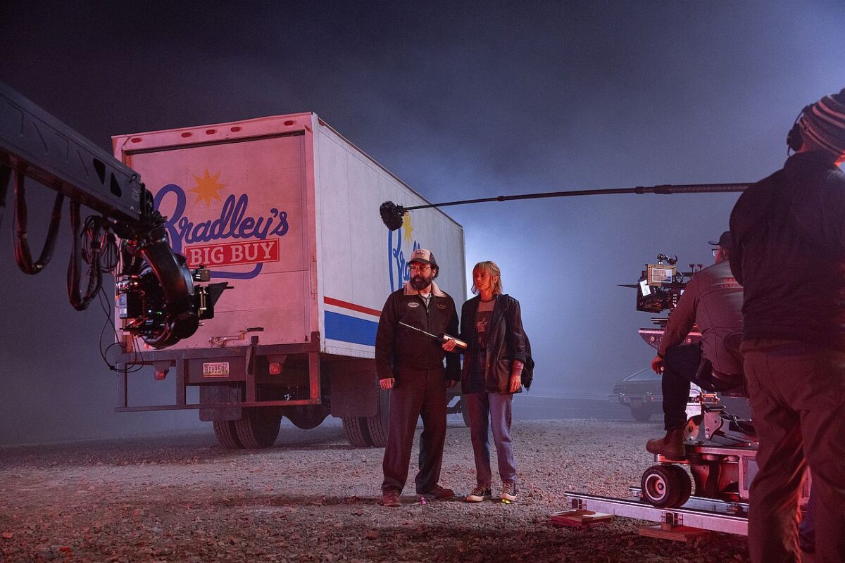 Brett Gelman as Murray Bauman and Maya Hawke as Robin Buckley behind the scenes of Stranger Things: Season 5
