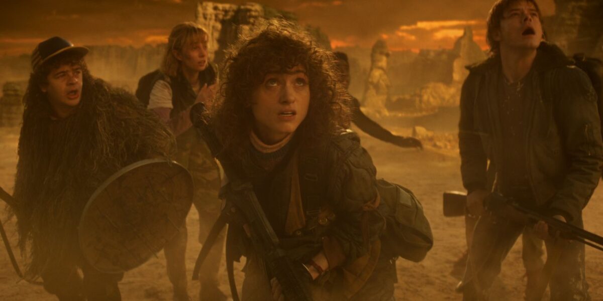 Gaten Matarazzo as Dustin Henderson, Maya Hawke as Robin Buckley, Natalia Dyer as Nancy Wheeler, Caleb McLaughlin as Lucas Sinclair, and Charlie Heaton as Jonathan Byers in Stranger Things: Season 5