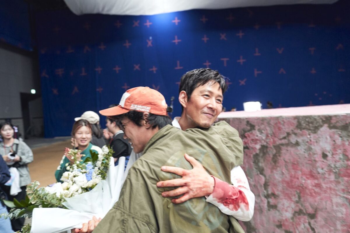 Squid Game S3 (L to R) Director Hwang Dong-hyuk, Lee Jung-jae as Seong Gi-hun
